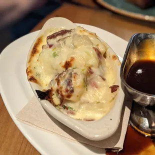 a plate of food and a gravy