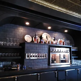 a bar with plates and glasses