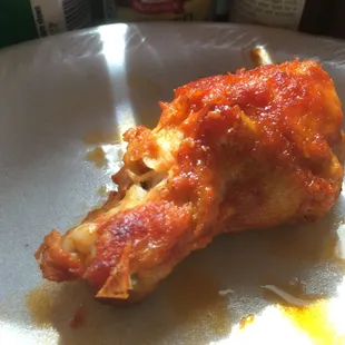 a piece of chicken wings on a plate