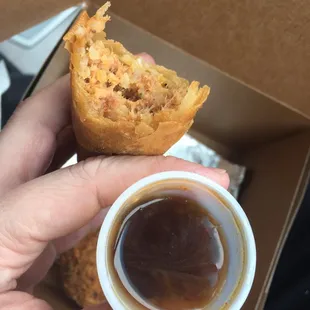 a hand holding a cup of coffee