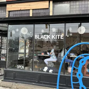 the front window of a cafe