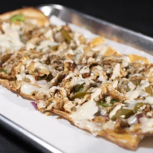 a closeup of a flatbread pizza