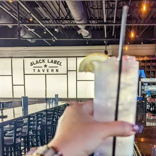 a person holding a drink