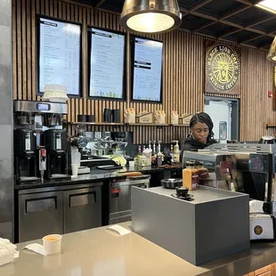 a bari serving a cup of coffee