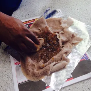 a person making a pita bread