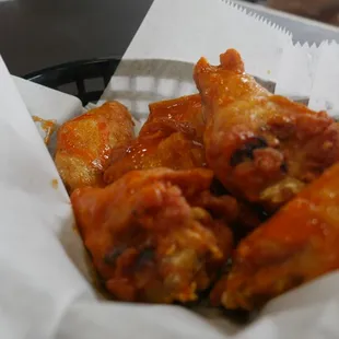 a basket of chicken wings