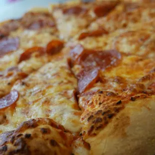 a pepperoni pizza on a plate