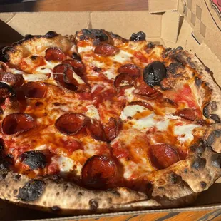 a pepperoni pizza in a box