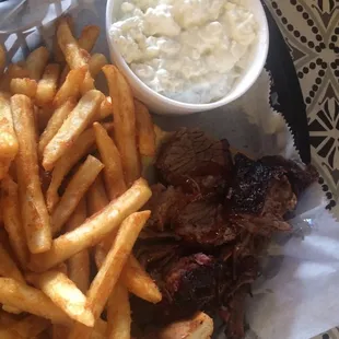 a plate of french fries and a sandwich