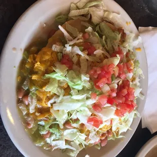 Indian taco (fry bread with chicken, pinto beans, Green Chile, lettuce and tomato's)