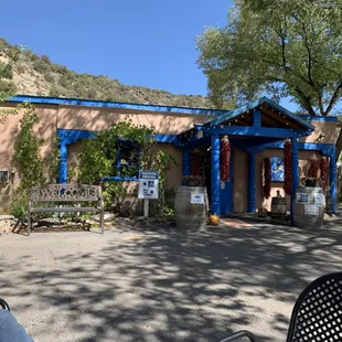 a man sitting in a chair in front of the winery