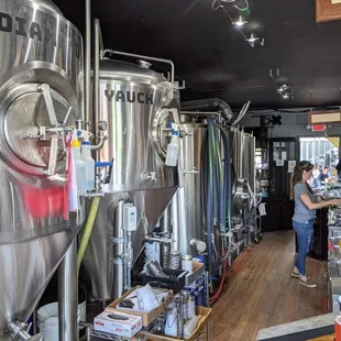 a woman working in a brewery