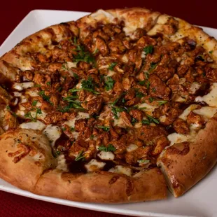 a large pizza on a white plate