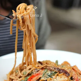 Seafood Carbonara ($28) - Linguini, shrimp, scallops, pork guanciale, confit garlic, peas, roasted peppers, spinach, parmesan, parsley