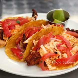 Fish Tacos ($21) - Tortilla crusted tilapia, cumin, chipotle mayo, spicy cabbage slaw, pico de gallo, lime, corn tortilla