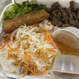 Rice noodles with grilled pork and spring rolls