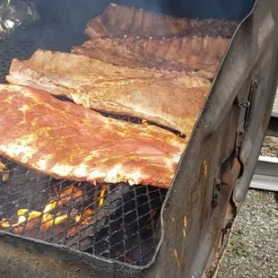 bacon cooking on a grill