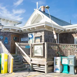 a wooden building with a staircase leading up to it