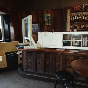 a small bar with a lot of bottles