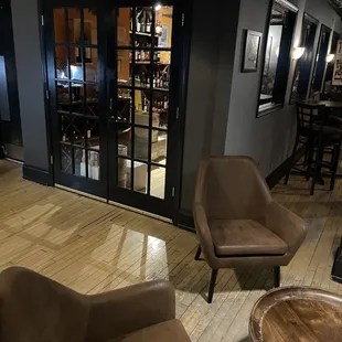 two chairs and a table in a room