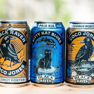 three cans of black raven