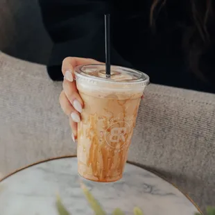 a person holding a drink