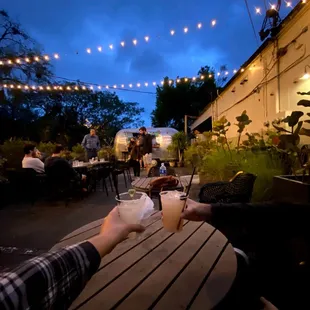 Outside patio behind black rooster. There&apos;s typically an outside bar.
