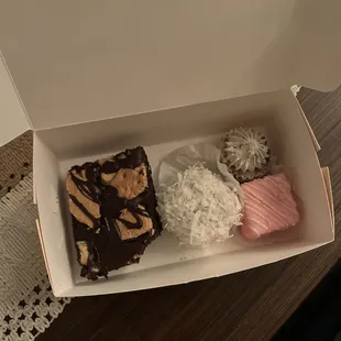 S&apos;mores brownie, coconut cake ball thing, Oreo cheesecake, strawberry petit four