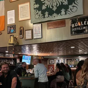 a group of people sitting at a bar