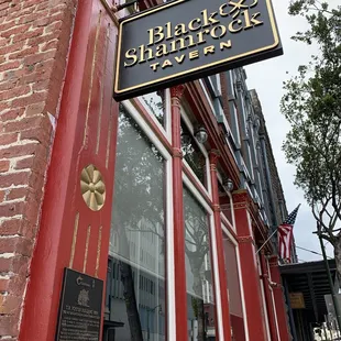 a sign on a red brick building