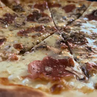 Serrano ham, mushrooms, and bleu cheese pizza