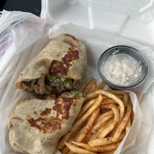 Chicken Caesar wrap and shoe string fries Togo (minus some eaten fries)