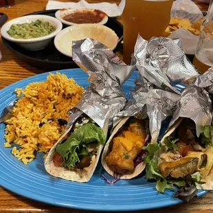 Flock of tacos with rice and black beans. Electric Petting Zoo IPA.