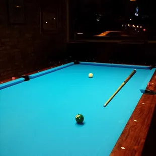 a pool table with a pool ball on it