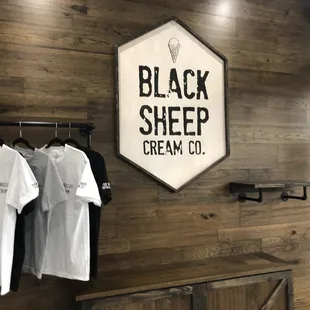 t - shirts hanging on a wall