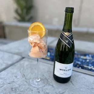 a bottle of wine and ice cubes