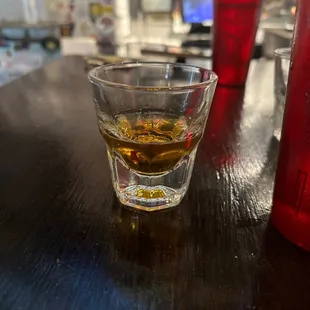 a shot of whiskey in a shot glass