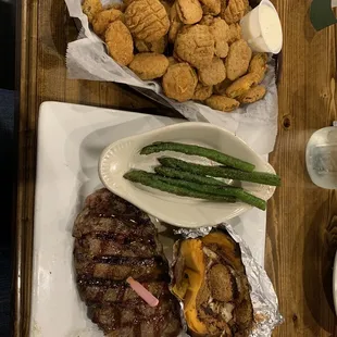Fried pickles 8oz Ribeye  Loaded baked sweet potato  Asparagus