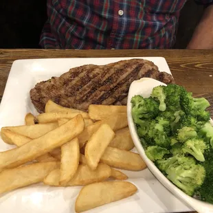 New York Strip Steak (Medium Rare) with steak fries and broccoli  10 oz. Sirloin Steak (Medium) with loaded baked potato