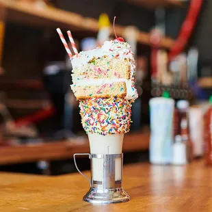 an ice cream sundae with sprinkles