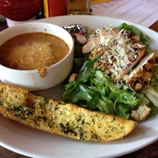 Chicken Caesar salad and creamy tomato basil soup.