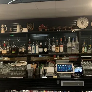 a bar with many bottles of alcohol
