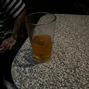 a glass of beer on a table