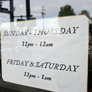 a sign in the window of a restaurant