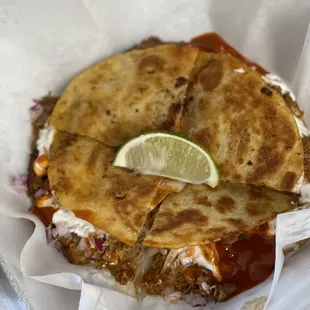 a quesadilla in a basket