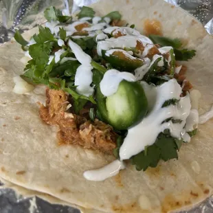 a taco with meat and vegetables