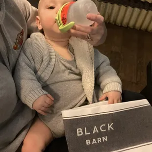 a baby drinking from a bottle