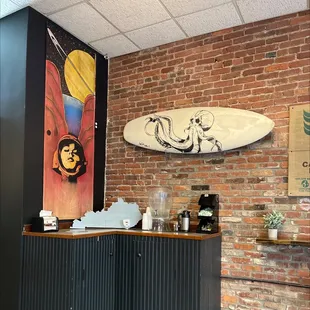 a surfboard on a brick wall