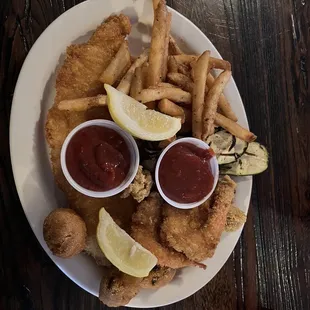 Fisherman's platter with french fries and grilled zucchini.