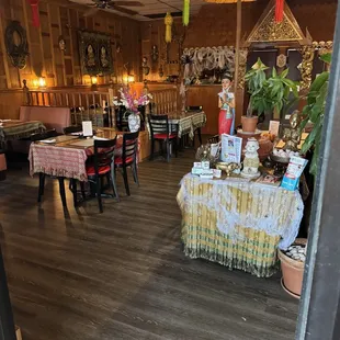a dining area with tables and chairs